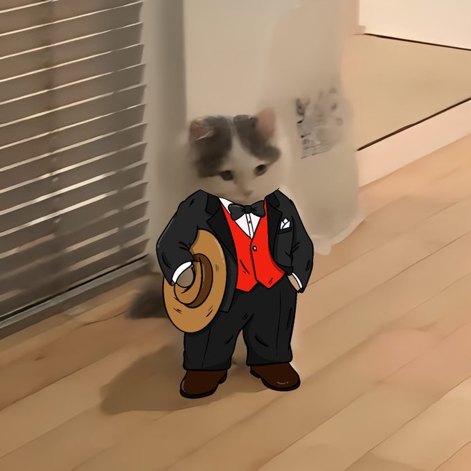 A digital illustration depicts a small kitten photoshopped onto a body wearing a black suit with a red vest, bow tie, and holding a brown hat, standing on a wooden floor in front of a white cat.