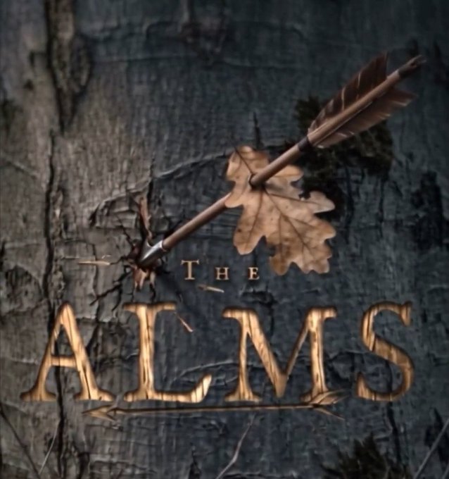 A logo for 'THE ALMS' showing golden text with an oak leaf and an arrow piercing through it, set against a tree bark background.