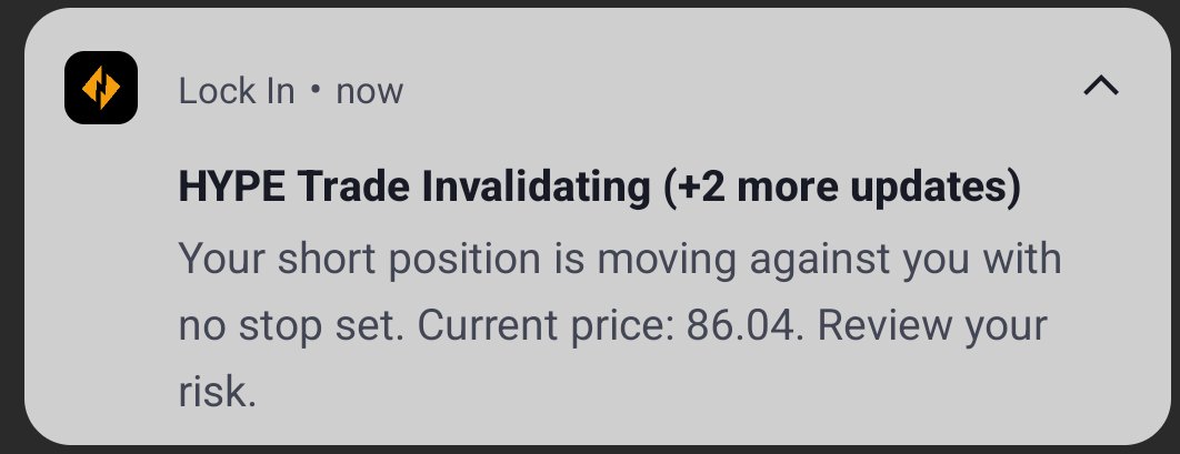 A notification alert from 'Lock In' titled 'HYPE Trade Invalidating (+2 more updates)' warning that a short position is moving against the user with no stop set at a current price of 86.04.