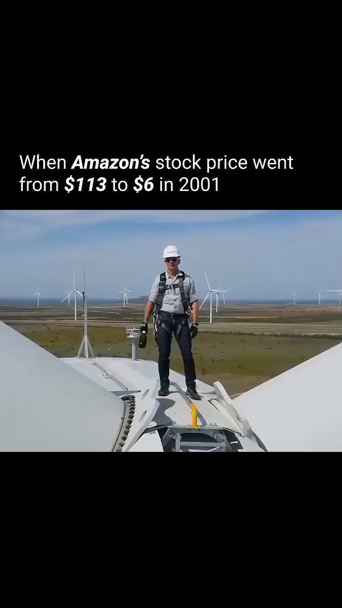 A man wearing a white hard hat, safety vest, and harness stands atop a wind turbine platform on social media, with a text box below stating that he went up the tower for work at Amazon when its stock price dropped from $7.83 to $6 in 2001.