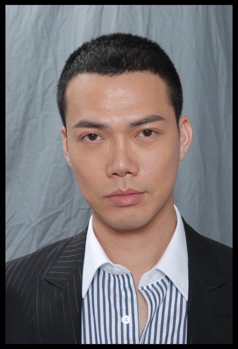 A man with short dark hair poses formally for a portrait against a gray backdrop, wearing a dark pinstripe blazer over a blue and white striped button-down shirt with the top button undone. His composed, confident expression visually embodies the post's message of finding one's ideal self-defined state—free from pressure, pretense, or compromise.