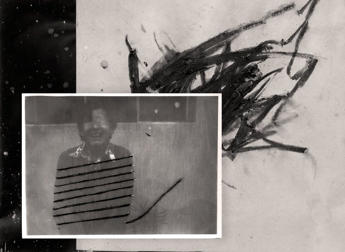 An artistic black-and-white composition featuring a faded photograph of a smiling person overlaid with dark paint streaks and scribbles.