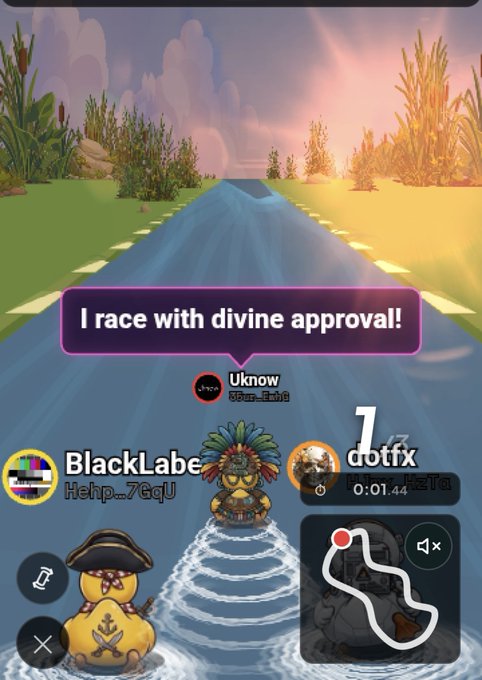 A screenshot of a duck racing video game showing three players ('BlackLabe...', 'Uknow', '1cottfx') on a river, with the top player stating 'I race with divine approval!' in a speech bubble.