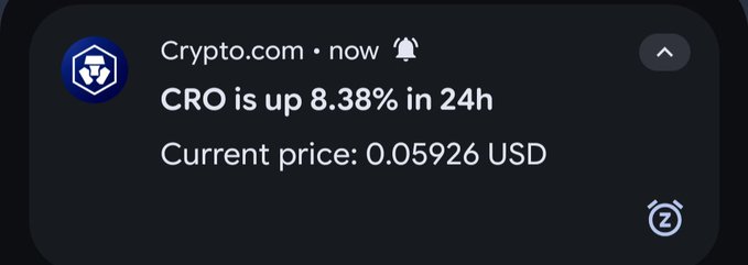 Crypto.com notification stating "CRO is up 8.38% in 24h" with a current price of 0.05926 USD.