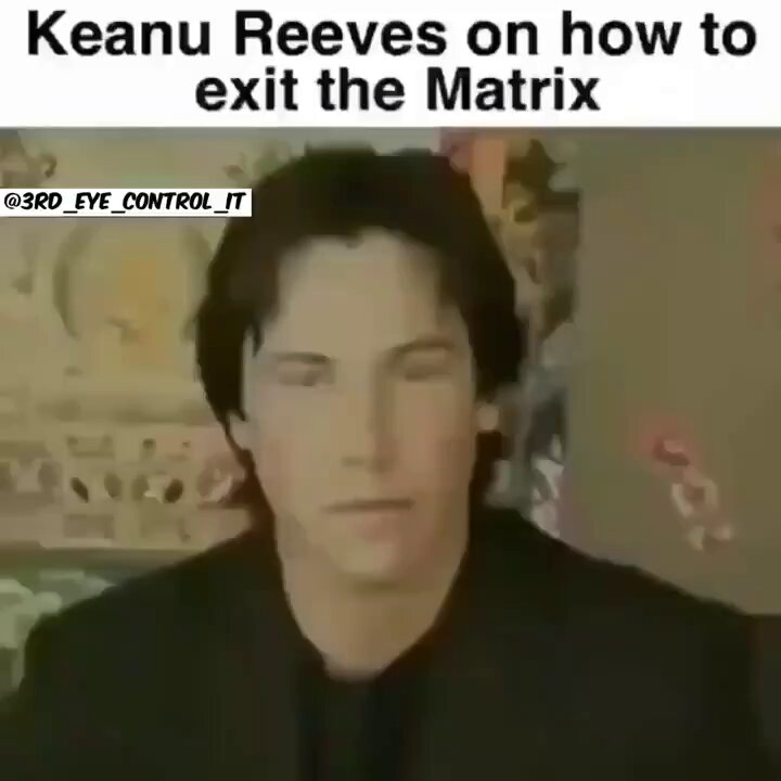 The image features a man with black hair, wearing a black shirt, sitting at a desk or table. He appears to be looking directly into the camera while posing for a photo. The caption of the image reads "Keanu Reeves on how to exit the Matrix" and there is an additional text that says "ROYAL CONTROL IT". This suggests that the image might have been taken during a conversation about Keanu Reeves' character or his role in the Matrix movie franchise, possibly as part of a discussion about the film's themes or plot.