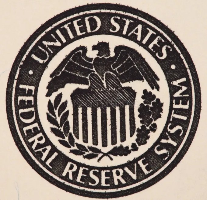 A vintage-style stamp or seal with the text 'UNITED STATES FEDERAL RESERVE SYSTEM' encircling an eagle emblem with a shield, olive branch, and arrows.