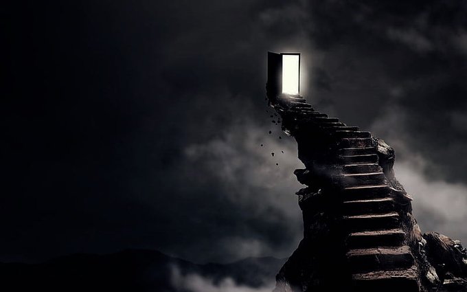 A dramatic dark fantasy image showing a rocky staircase leading up to an open, glowing white doorway against a stormy, cloudy night sky.