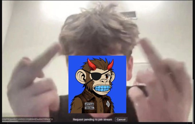 A blurred image of a person gesturing with their hands, overlaid with a cartoon ape character wearing devil horns, an eye patch, and an 'APETM ORIGINAL' jacket on a blue background.