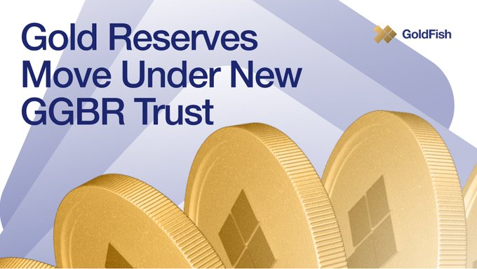 A promotional graphic for 'GoldFish' reads 'Gold Reserves Move Under New GGBR Trust' alongside an image of three stacked gold coins against a light blue background.