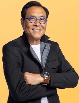 Robert Kiyosaki, known for his "Rich Dad Poor Dad" books, smiles warmly while wearing blue glasses and a black blazer against a yellow background, displaying a watch on his crossed arms. The image relates to the post as Kiyosaki is the subject of a debunked claim that XRP could make investors the "richest person in your family," which the post identifies as fabricated misinformation.
