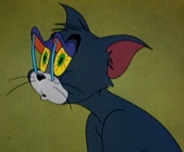 Tom from Tom and Jerry, the classic cartoon cat, depicted with his characteristic blue fur and large expressive eyes.
