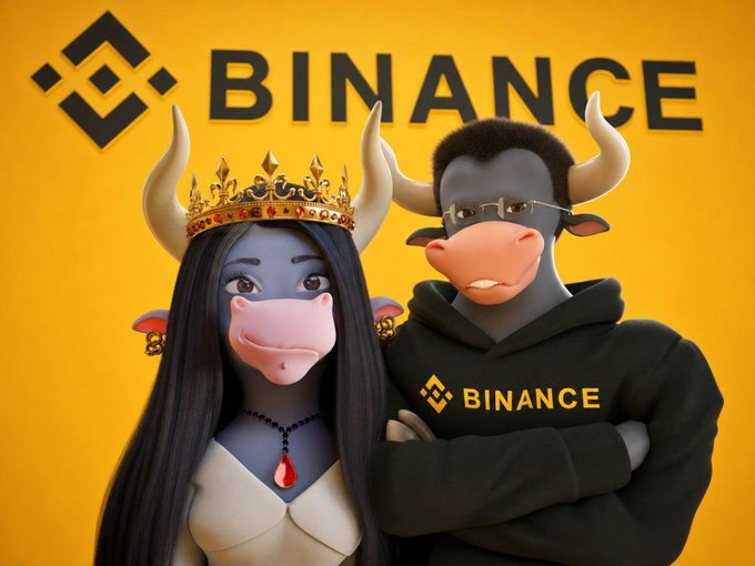 A promotional image for Binance cryptocurrency exchange features two characters with bull horns and cow faces against a yellow Binance-branded background, with one wearing a gold crown and the other wearing a black Binance hoodie.