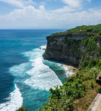 Pristine turquoise waters crash against Bali's towering green cliffs, a serene tropical paradise that starkly contrasts with the alarming reality of crypto-targeted kidnappings and extortions happening on the island.