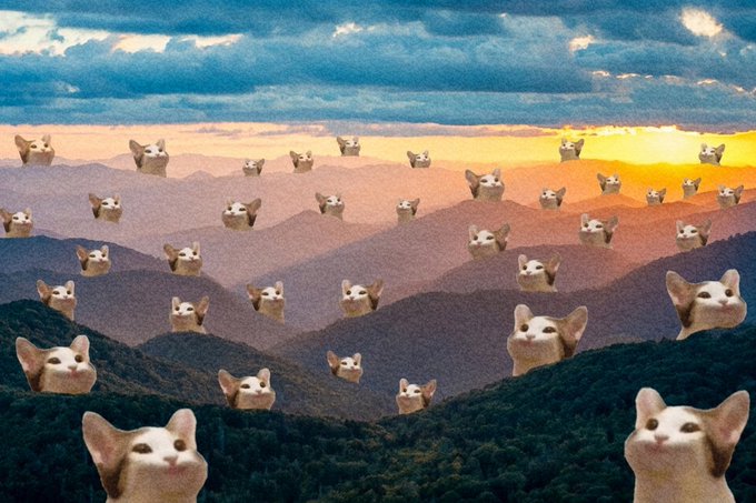A humorous edited landscape image showing numerous cat faces superimposed across a mountain range at sunset, with the repeating cat faces appearing to emerge from the rolling hills.