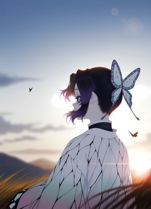 The image features a woman with long hair wearing a white dress, standing in front of a field at sunset. She has a butterfly perched on her head, adding a whimsical touch to her appearance. The background includes a sky filled with clouds and mountains, creating a serene atmosphere for the scene. The post also mentions that there are butterflies present in the image, which further emphasizes the connection between the woman's attire and the natural elements surrounding her.