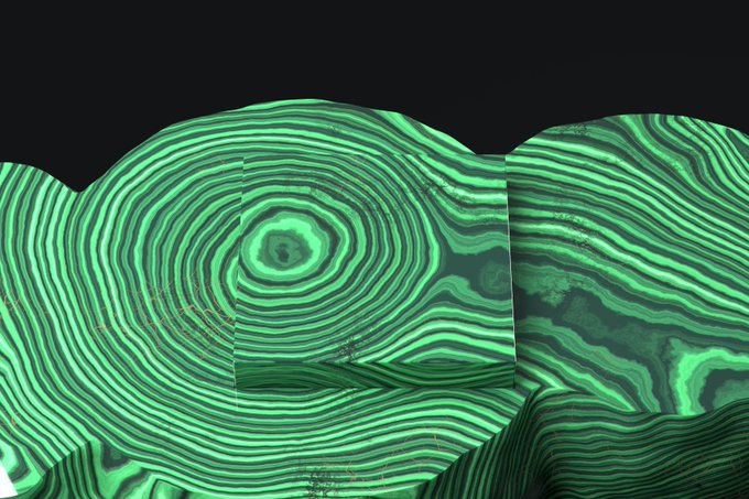 An abstract digital artwork featuring swirling green and black concentric patterns resembling malachite stone or topographic lines.