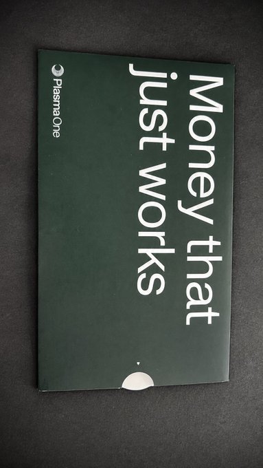 A dark green booklet or pamphlet from 'Plasmaone' with the large white text 'Money that just works' printed vertically.