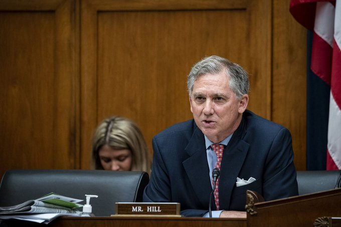 French Hill, identified by the "MR. HILL" nameplate, speaks at a congressional hearing with an American flag in the background, as the accompanying post highlights his role in advancing the CLARITY Act—a major piece of crypto legislation aimed at establishing a regulatory framework for digital assets in the U.S. The image captures a key moment in the bill's progression, showing the lawmaker at the podium driving this long-awaited industry development forward.