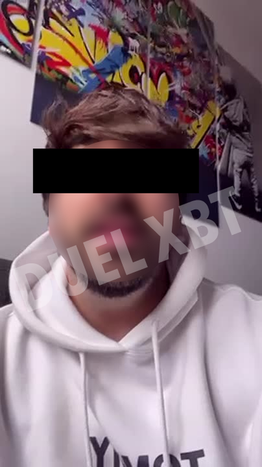A young man in a white hoodie has his eyes obscured by a black censor bar and his face partially blurred, with the watermark "DUEL XBT" overlaid diagonally across the image, which appears to identify a suspect in the Duel crypto heist as referenced in the post.