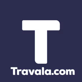 The Travala.com logo, featuring a bold white "T" on a dark purple background, is displayed as the crypto-native travel booking platform reports a data breach exposing customer names, emails, and hashed passwords.