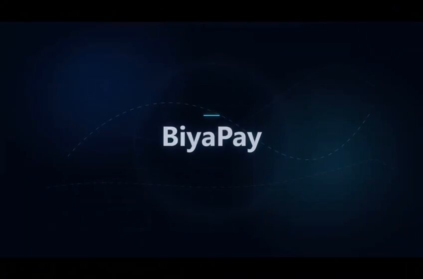 The image features a large blue screen with white text that says "BiyaPay" written in white letters. The background of the image is black, which makes the white text stand out prominently. There are no other objects or texts present in the image, so the focus is solely on the "BiyaPay" message displayed on the screen.