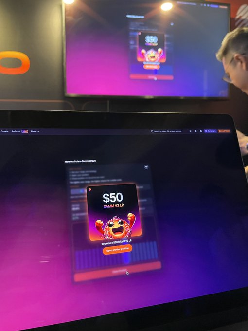 A laptop and TV screen both display a 'Monsterra Bullrun Summit 2026' promotion showing a '$50 DAMM YZ UP' reward popup with a monster mascot character.