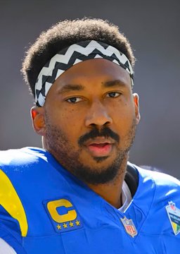 A dejected Myles Garrett, wearing his signature headband and a Rams jersey with a captain's "C" patch, looks downward in apparent frustration after his zero-tackle performance against the 49ers. The image captures the somber mood of the star pass rusher, reflecting his own admission that this was "the worst version" of himself on the field.