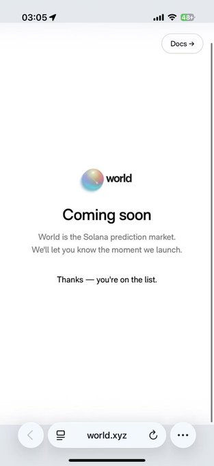Mobile screenshot of world.xyz showing a "Coming soon" page with the message "World is the Solana prediction market. We'll let you know the moment we launch. Thanks — you're on the list."