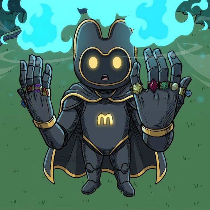 A small, armored hooded figure with glowing yellow eyes and a glowing "M" emblem on its chest stands with both hands raised, displaying multiple Infinity Gauntlet-style rings on its fingers, while blue flame-like energy billows behind it. The image, labeled "Gmakooor" by the artist, blends cute character design with Marvel's Avengers: 0 War/Endgame "snap" aesthetic.