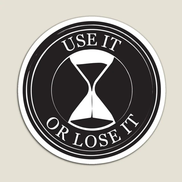 Black and white circular sticker with an hourglass illustration and the text "USE IT OR LOSE IT"