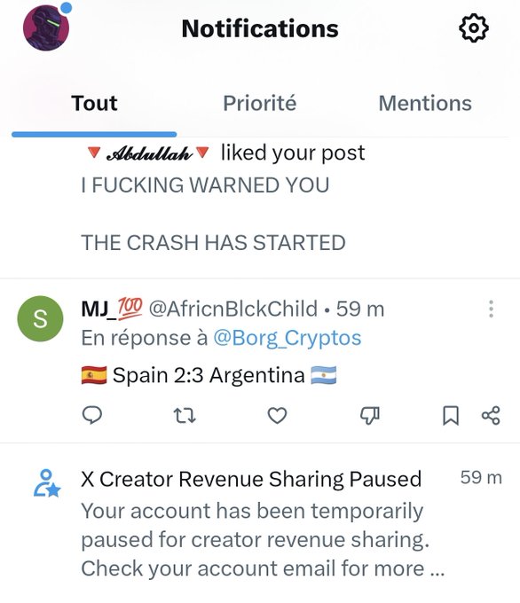 A screenshot of X (Twitter) notifications showing a post liked by "Abdullah" with the text "I FUCKING WARNED YOU / THE CRASH HAS STARTED," a reply from MJ_100 about "Spain 2:3 Argentina," and a notice that "X Creator Revenue Sharing Paused," tying into the caption's joke about tweeting for free now that revenue sharing has been suspended.