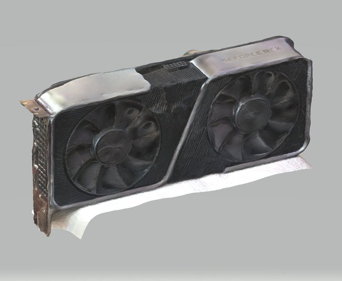 A 3D render or photograph of an NVIDIA GeForce RTX graphics card with dual black cooling fans and a silver/carbon-fiber casing, set against a plain gray background.
