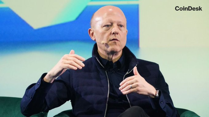 Circle CEO Jeremy Allaire speaks during a CoinDesk event, with the "CoinDesk" logo visible in the top right corner of the backdrop. The image illustrates the accompanying post about Allaire announcing USDC's expansion into approximately 50 emerging markets across Southeast Asia, Latin America, and the Middle East.