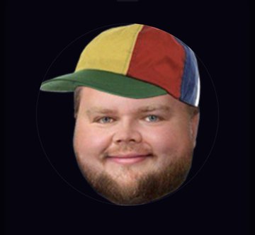 A circular logo featuring a man's face with a beard wearing a colorful red, yellow, blue, and green paneled cap on a black background.