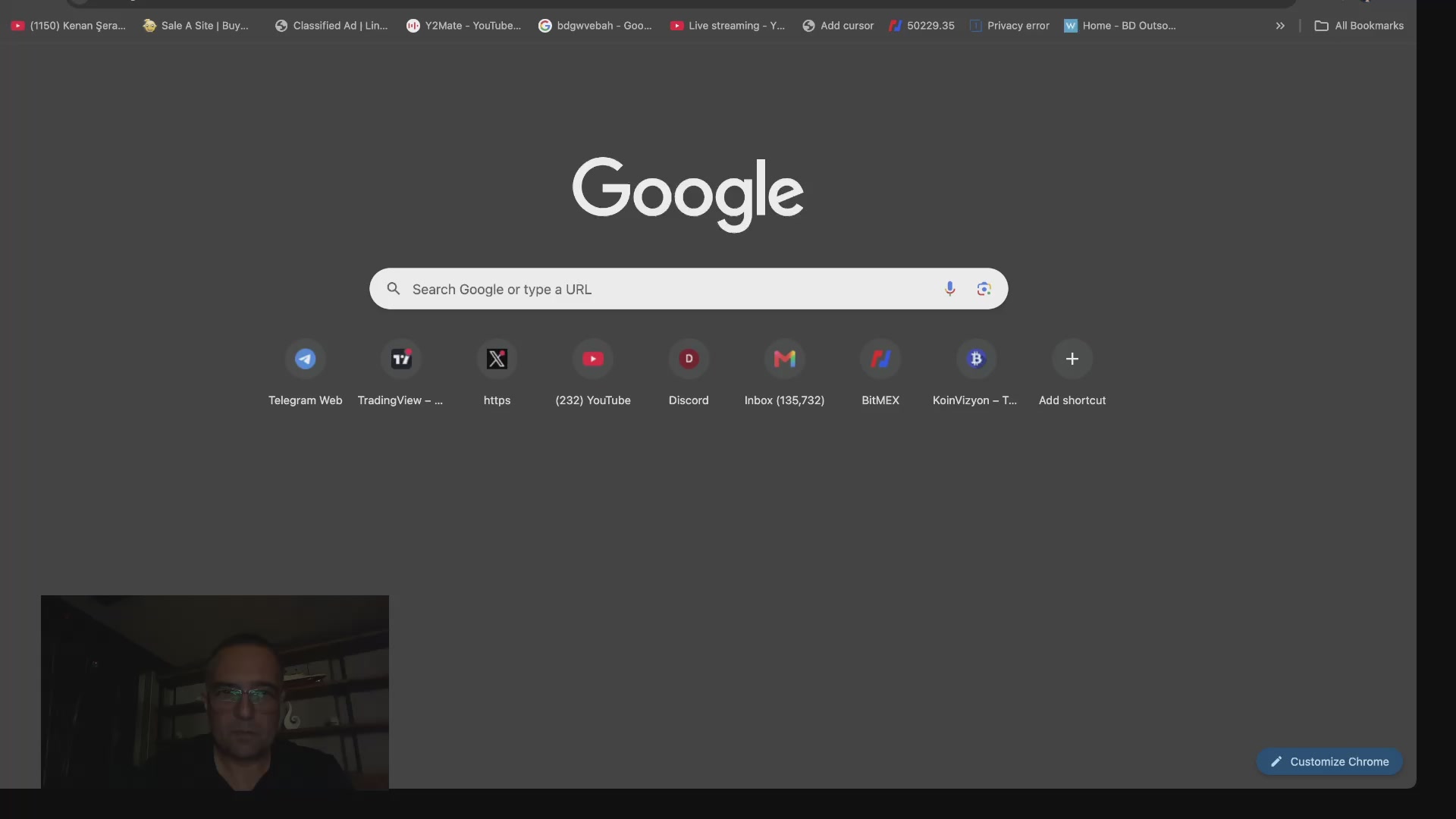 The image shows a man wearing glasses sitting at his computer, with a screen displaying Google's search bar. The focus of the image seems to be on the man and his interaction with the search engine. There are no other objects or people visible in the image, and the main subject is the man using the Google Chrome browser.