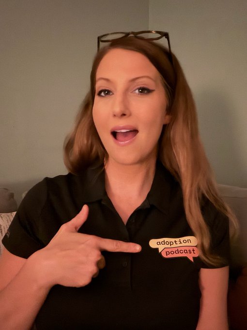 A woman with sunglasses perched on her head points to a "adoption podcast" badge on her black top, promoting an upcoming live broadcast for "T.A.P." featuring guests @Evan_Mann and @alexfacelesslbs in 10 minutes.