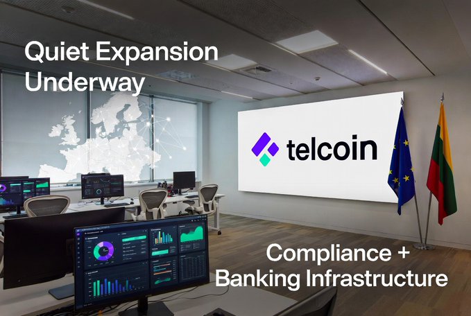 A promotional banner for 'telcoin' featuring the text 'Quiet Expansion Underway' and 'Compliance + Banking Infrastructure' over an image of a modern office with EU and Lithuanian flags.