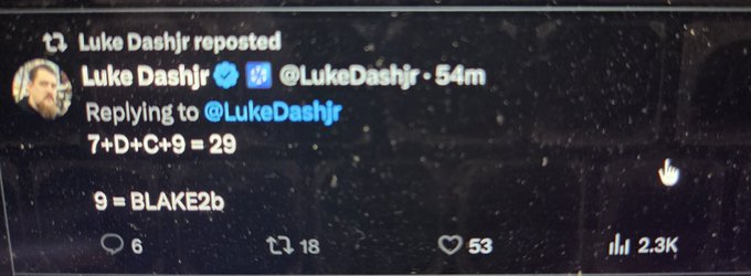 A screenshot of a tweet by Luke Dashjr (@LukeDashjr) replying to himself with the text '7+D+C+9 = 29' and '9 = BLAKE2b', showing 53 likes and 2.3K views.