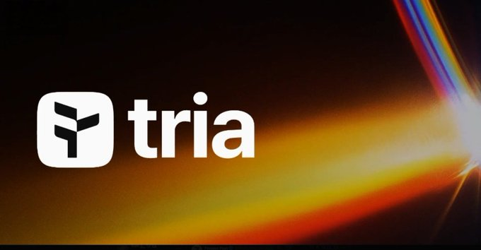 A logo image for 'tria' featuring a white Y-shaped icon on a dark background with rainbow light streaks.