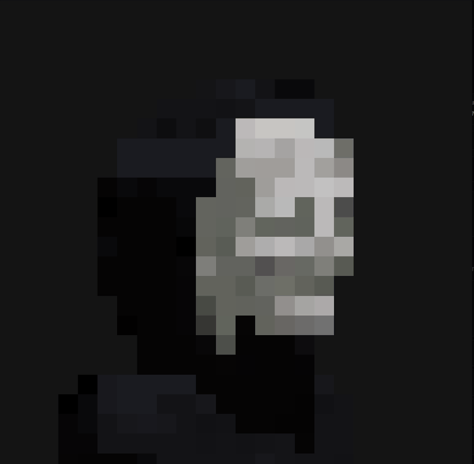 A pixelated grayscale portrait of a smiling man wearing glasses.