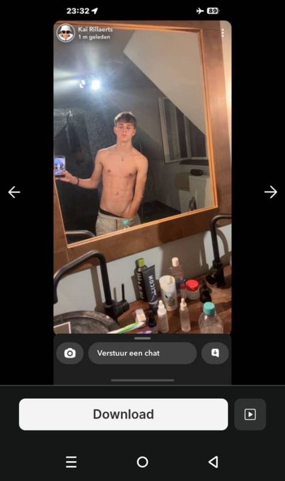 A shirtless young man takes a mirror selfie with his phone, standing in a bathroom with various toiletries visible on the counter, shared in a Snap story from "Kai Rillaerts" with a "Download" prompt below. The image relates to the "t.me/evanbait1" post as part of a Snapchat story leak, where private content is being distributed without consent.