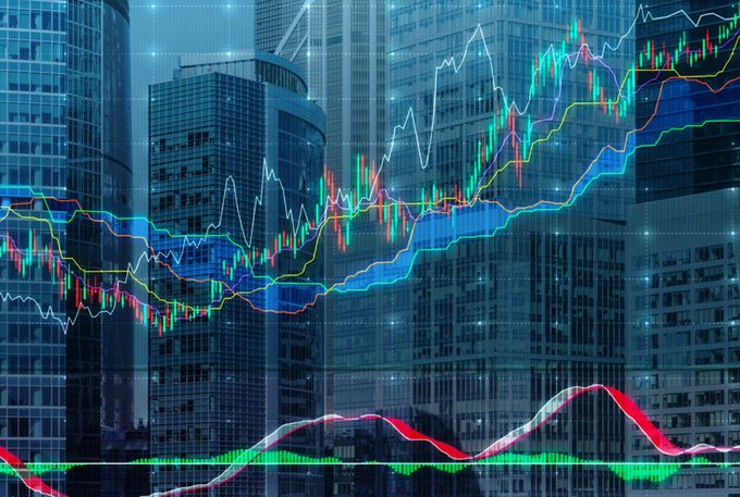 Financial graphic showing colorful stock/crypto candlestick charts, moving averages, and MACD indicators overlaid on an image of modern city skyscrapers.