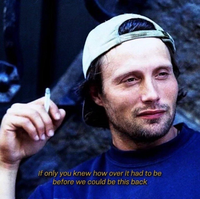 A meme featuring a man in a backwards cap smoking, with the caption 'If only you knew how over it had to be before we could be this back'.