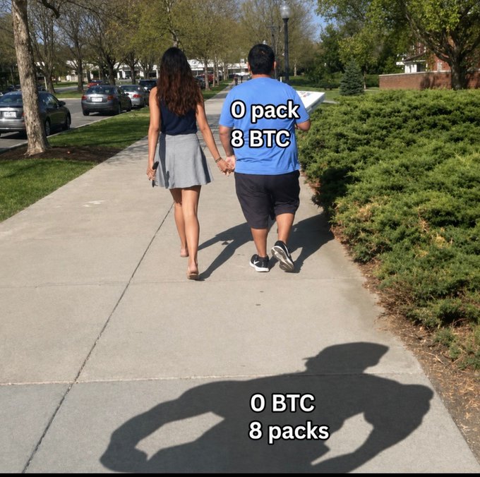 A couple walks hand-in-hand down a sunny sidewalk, with text overlays humorously contrasting their priorities: the man displays "0 pack / 8 BTC" while their shadow reveals the truth—"0 BTC / 8 packs"—illustrating the joke's punchline about gym gains outlasting crypto gains by 2040.