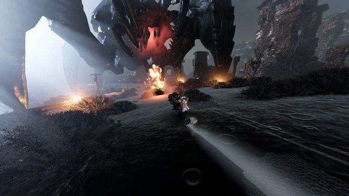 A futuristic mech suit traverses a dark, otherworldly landscape toward a massive red, glowing alien creature and a small companion robot.
