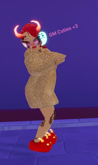 A 3D animated avatar of a stylized female character with red hair, sunglasses, horns, and a fuzzy coat, accompanied by a small ghost and the text 'GM Cuties <3'.