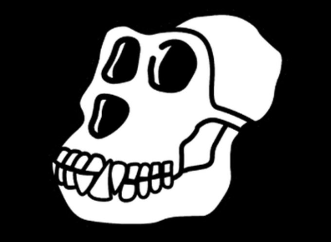 A black and white cartoon illustration depicts a skull with exaggerated large eyes and prominent teeth against a black background.