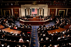 The image shows the interior of the U.S. House Chamber during a joint session of Congress, with the dais, podium and seated members visible. It relates to the post by depicting the legislative setting where the CLARITY Act ethics proposal regarding cryptocurrency and presidential profits would be debated.