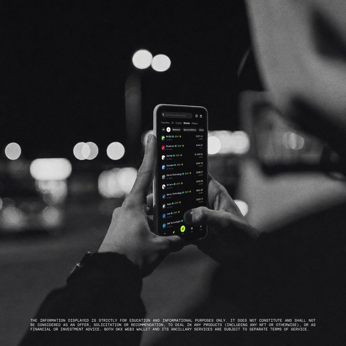 A person holds a smartphone displaying a crypto wallet portfolio with tokenized assets like Bitcoin, Ethereum, Solana, and companies including Apple and Tesla, set against a blurred nighttime city backdrop. The image reinforces the post's message by visually showcasing the wallet's all-in-one onchain experience that combines crypto, stocks, and commodities accessible anytime, anywhere.