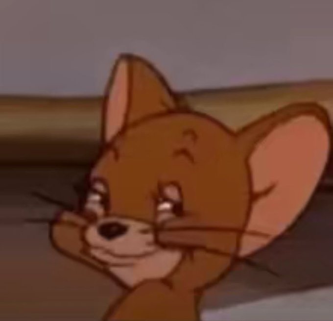 A close-up animated shot of a sad Jerry the Mouse from Tom and Jerry, looking upward with tears in his eyes.